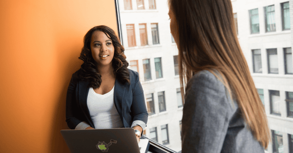 two women working together 